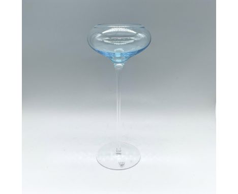 A clear long stem footed glass candleholder with a sky-blue glass bowl on top. Orrefors marked. Artist: Erika LagerbielkeIssu