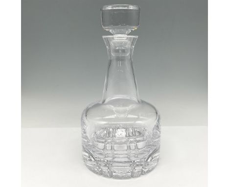 Clear crystal tapered neck to clear bulb base with hand cut grid pattern design. Decanter has a capacity of 26oz. Crystal sto