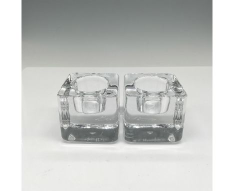 Realistic cube design with clear center holder. Orrefors mark. This item has its original box: 3"L x 3"W x 3"H. Artist: Goran