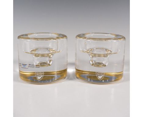 A set of 2 clear votive candle holders with a hand painted golden rings on the bottoms. Orrefors stickered. Items have its or