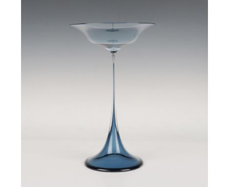 A periwinkle blue Swedish glass with a flared top and bottom. Orrefors Expo etched on the underside. Artist: Nils LandbergIss