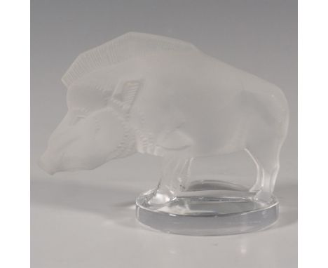 A frosted figure of a wild pig that can be displayed on a shelf or as a paperweight on a desk. Lalique France etched on the u