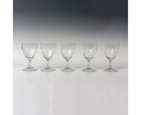 A set of wine glasses featuring a diamond-cut pattern joined with a leaf-like design, accentuated by a hexagonal stem. This i