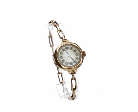LADY'S EARLY TWENTIETH CENTURY NINE CARAT GOLD MANUAL WIND WRIST WATCHunsigned 15 jewel movement, the round silver coloured d