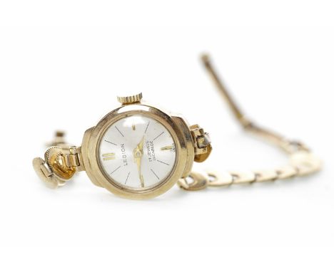 LADY'S NINE CARAT GOLD LEGION MANUAL WIND WRIST WATCH the round cream dial with applied gold coloured baton hour markers at 1