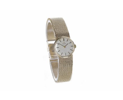 LADY'S OMEGA NINE CARAT GOLD MANUAL WIND WRIST WATCHthe round buff dial with applied gold baton hour markers, gold pencil han