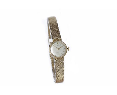 LADY'S CYMA NINE CARAT GOLD MANUAL WIND WRIST WATCH1960s, the round dial with applied gold baton hour markers, on a nine cara