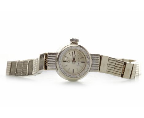 LADY'S OMEGA NINE CARAT WHITE GOLD MANUAL WIND COCKTAIL WATCHthe round dial with applied baton hour markers, pencil hands, 19