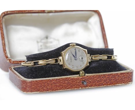 LADY'S ZODIAC NINE CARAT GOLD MANUAL WIND WRISTWATCHthe round white dial with applied Arabic hour markers, subsidiary seconds
