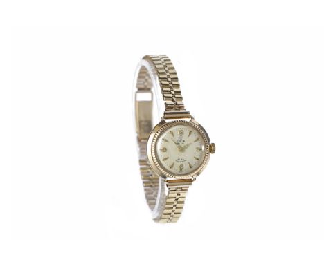 LADY'S TUDOR ROYAL NINE CARAT GOLD MANUAL WIND WRIST WATCHthe round buff dial with applied arrow hour markers and Arabic 12, 