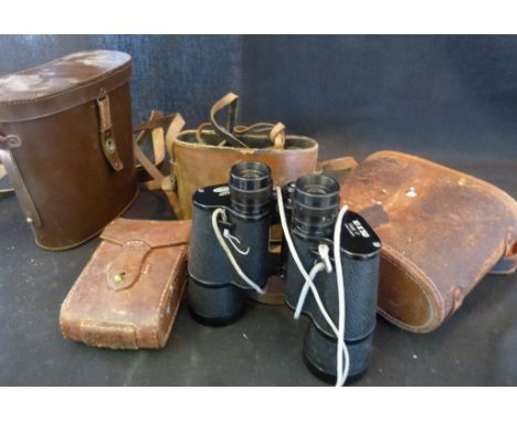 A Pair of Champion Binoculars within Leather Case, together with another pair of binoculars and a folding camera
