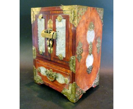 A Chinese Jade Set Table Cabinet, with two doors above a drawer and with side panels