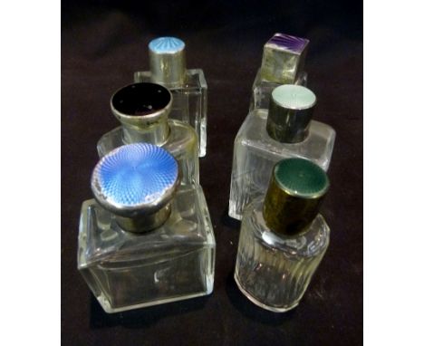 A Group of Six Silver and Enamel Topped Glass Scent Bottles