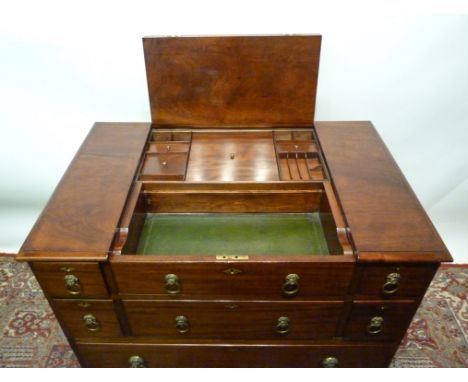 A 19th Century Mahogany Two Part Campaign Chest, the moulded top with a double hinged section enclosing compartments and pige