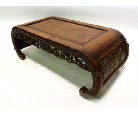 A Late 19th, Early 20th Century Chinese Hardwood Opium Table, with a pierced carved frieze and shaped scroll feet, 88 cms lon