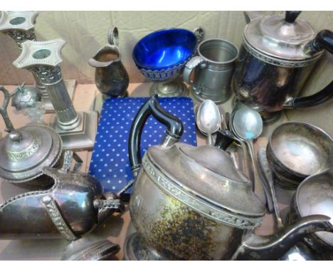 A Collection of Plated Items, to include a tea service, a pair of dwarf candlesticks and various items of flatware