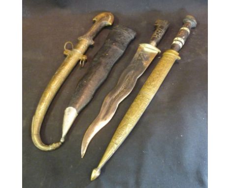 An Eastern Jambiya with Brass Scabbard, together with two other similar knives