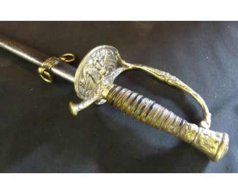 An American Officers Dress Sword, with metal scabbard, the guard embossed with an eagle