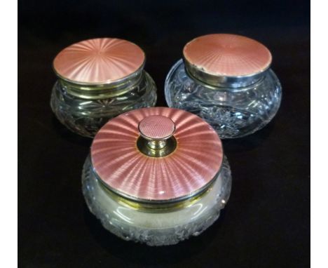 A Birmingham Silver and Pink Enamel Cut Glass Dressing Table Powder Bowl, together with two other similar cut glass silver mo