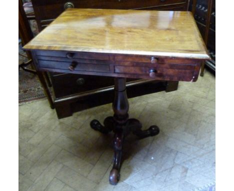 A Victorian Mahogany Work Table, with four frieze drawers with knob handles raised upon a turned tapering centre column and t