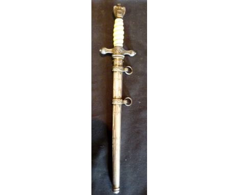 A World War Two German Naval Dagger, with ivory grip and engraved scabbard