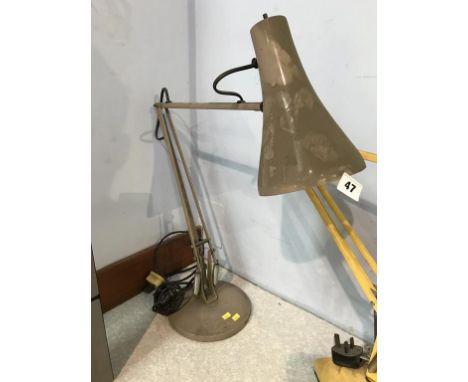 A grey angle poise lamp