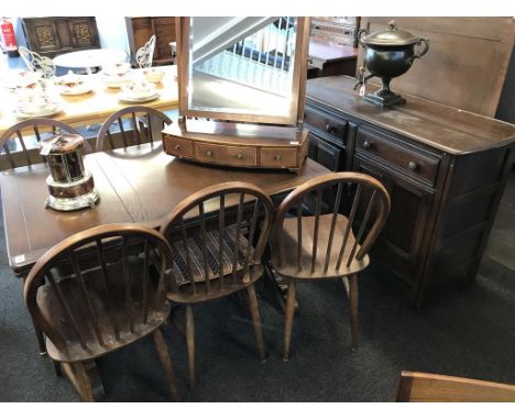 An Ercol eight piece dining room suite