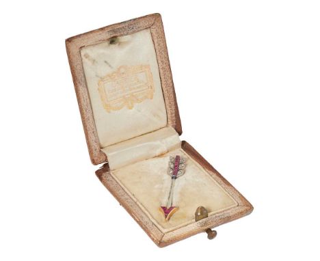 Cartier: An early 20th century ruby and diamond arrow brooch, circa 1920 channel-set with calibré-cut rubies and rose-cut dia