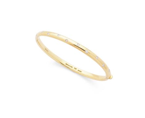 Tiffany &amp; Co: A diamond bangle of hinged design, gypsy-set with ten round brilliant-cut diamonds, stamped TIFFANY &amp; C