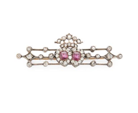 A late 19th century ruby and diamond brooch modelled as a crowned double heart  motif, set throughout with rose-cut diamonds 