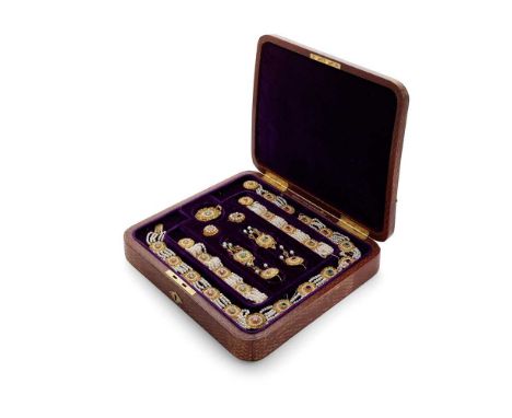 An Indian late 19th century gem-set jewellery suite comprising a necklace, a pair of bracelets, a pair of earrings with detac