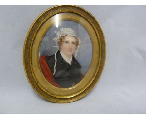 A Regency portrait miniature, of a woman with ringlets and lace cap, in an oval gilded metal frame with domed glass, 13cm dia