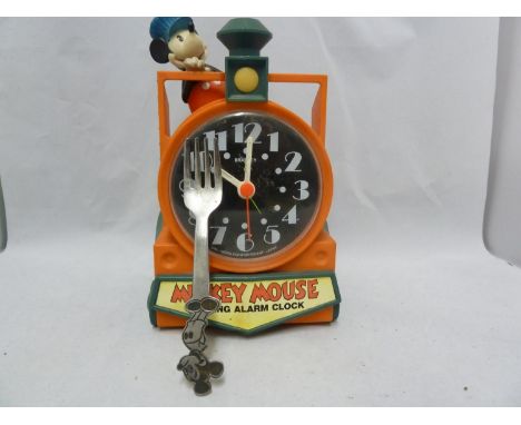 A Mickey Mouse talking alarm clock, plastic, formed as a railway engine with Mickey Mouse as the Driver, the dial marked Brad