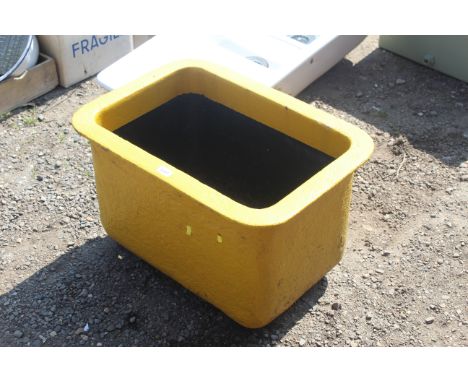 A painted cast iron trough/planter