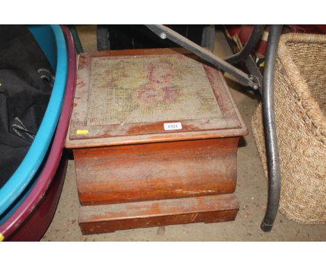 A commode enclosed within a wooden case with embroidered top AF