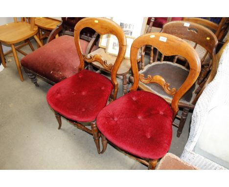 A pair of button down upholstered balloon back chairs