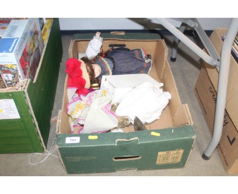 A box containing collectors dolls, vintage pinball game, various brassware etc.