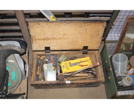 A wooden toolbox and contents of various tools to include hand borers, riveting tool, files and a lightweight metal spirit le