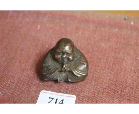 A bronzed model of a seated Buddha (79)