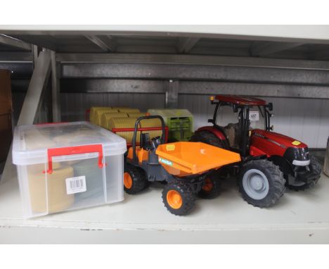 A Britain's 1/16th Case 210 tractor; a Bruder Claas baler; Bruder bale trailer, bales and a Bruder Ausa dumper