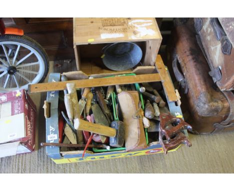 A tray box containing tools to include wooden measure, hand saws, mallet, oil cans etc.