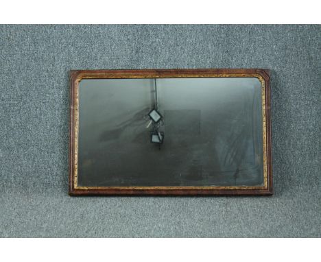 Wall mirror, Georgian walnut framed and parcel gilt. H.48 W.77cm. 