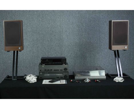Hi-Fi stack made up of NAD amplifier and tuner. Dual turntable. A&amp;R speakers. The woofer has some damage. H.83 cm. (large
