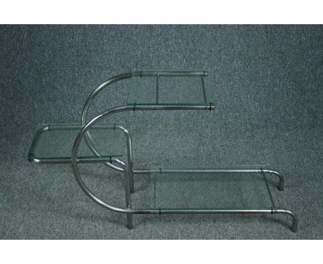After Emile Guillot, a 1930's plate glass and chrome etagere in the Bauhaus style. H.56 W.105 D.30cm. 