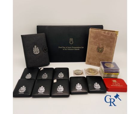 Coins: Large lot of silver coins mainly dollars, attached a folder "First day of issue presentation set of the first national