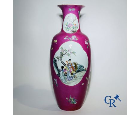 Chinese porcelain: A fine famille rose vase decorated on a red ruby background in sgraffito technique. Marked Qianlong. 61 cm