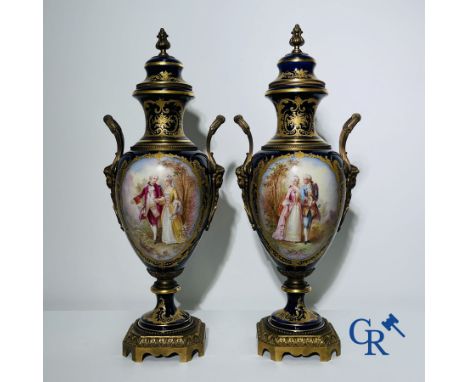 Porcelain: Sèvres: Pair of vases in Sèvres porcelain, bronze mounted with romantic scenes in the style of Watteau. Signed G. 