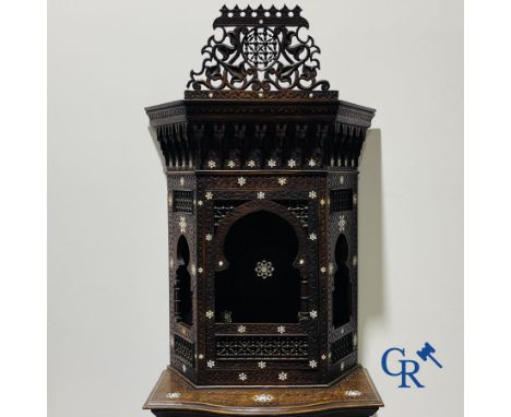 Sculpted furniture with inlays of ebony and mother-of-pearl. Syria, early 19th century. 232 x 90 x 49 cm.