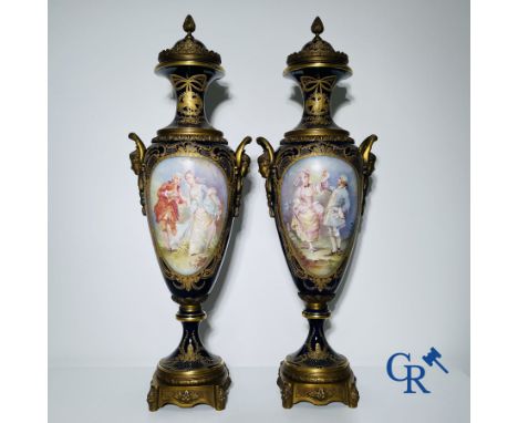 Porcelain: Sèvres: Pair of large bronze mounted vases in Sevres porcelain with romantic scenes in the style of Watteau. Signe