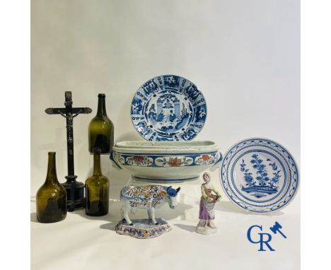 Part of an 18th century Northern French fountain (Rouen or Saint Omer) a cow and a character in French faience, 2 plates in f